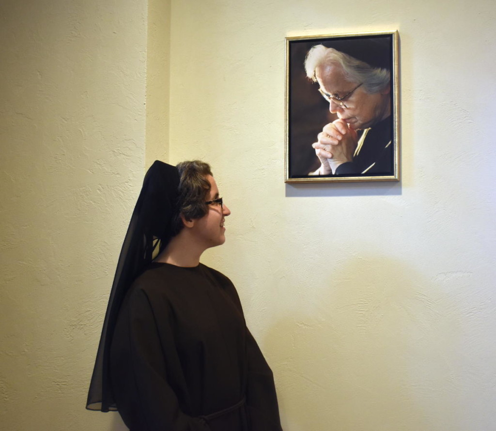 Sister Carmina Rose gazes at a photo of Mother Rosemae, her patron.