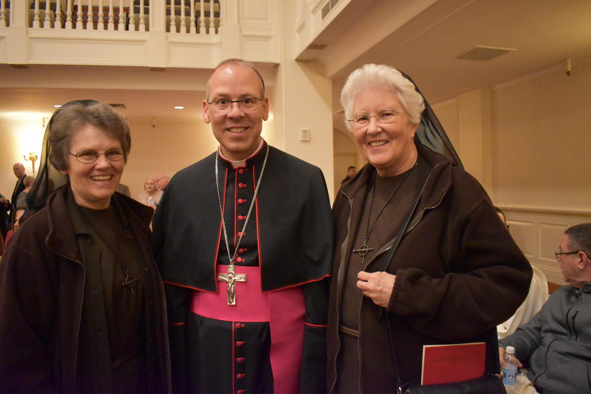 Sister Barbara Johnson, FSE and Sister Mary Richards, FSE greet Bishop Betancourt.